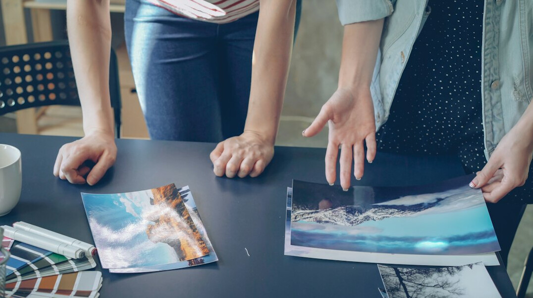 Team of colleagues discussing around a table in a bright office